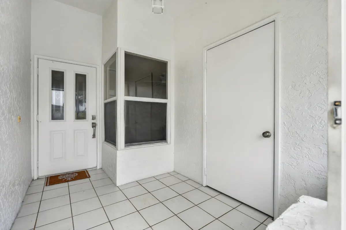 Front Covered Patio Entry at 10924 SE STONEHILL Lane, Hobe Sound