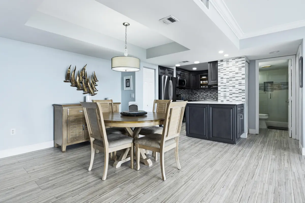 Dining area with tray ceiling at 5600 N Flagler Drive 1105, West Palm Beach