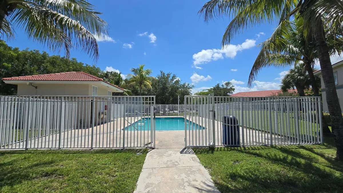 Community Pool Fence at 1161 Golden Lakes Boulevard 1311, West Palm Beach