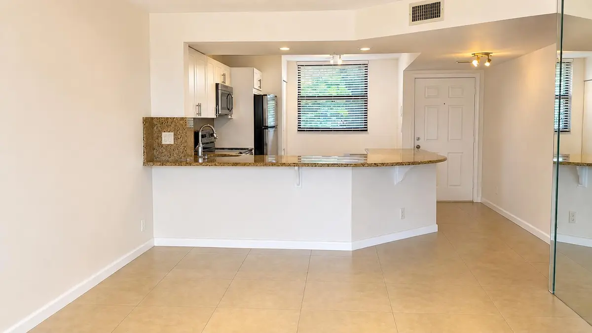 entry-kitchen-mirror at 115 Lake Emerald Drive 210, Oakland Park