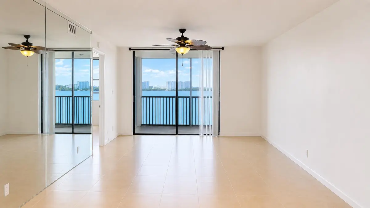 living-room-mirrored-wall at 115 Lake Emerald Drive 210, Oakland Park