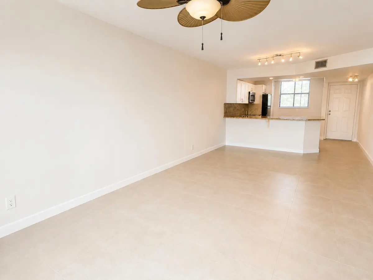 living-room-kitchen-view at 115 Lake Emerald Drive 210, Oakland Park
