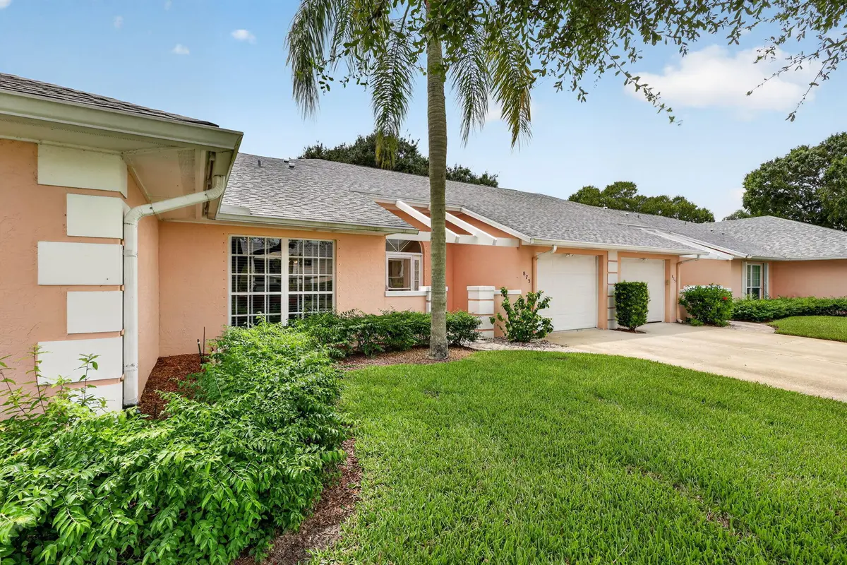 Morning Front View at 873 LAKE ORCHID Circle, Vero Beach