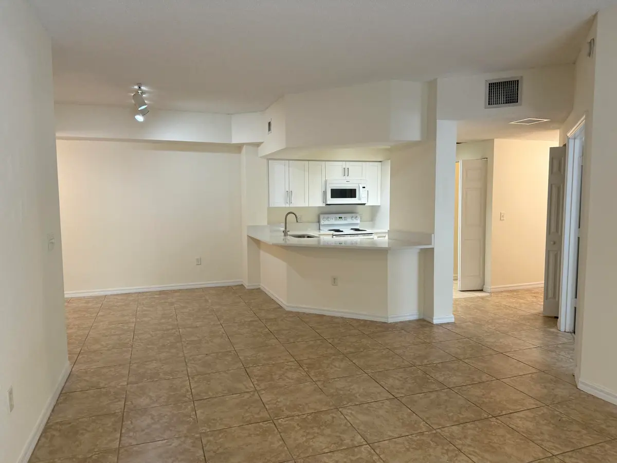 Kitchen & Living Room at 3020 Alcazar Place 303, Palm Beach Gardens