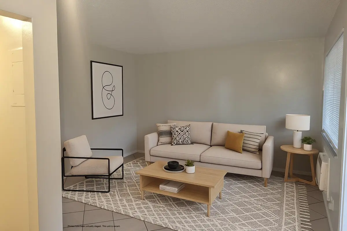 Living room from dining room - staged at 1129 NE 5th Terrace 2, Fort Lauderdale
