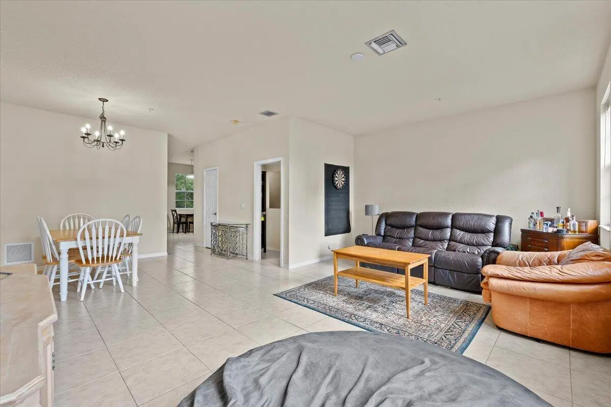 Dining / Living Room at 335 E Thatch Palm Circle 104, Jupiter