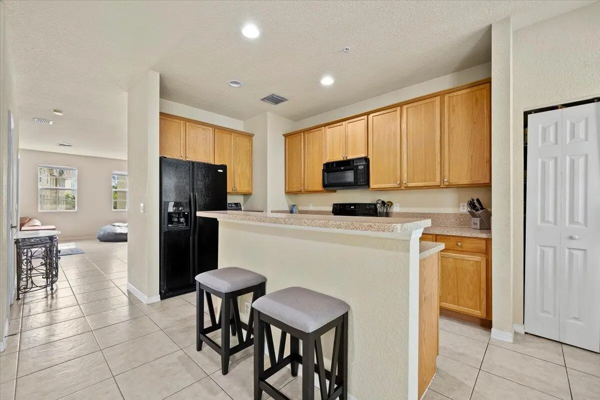 Kitchen / Living Room at 335 E Thatch Palm Circle 104, Jupiter