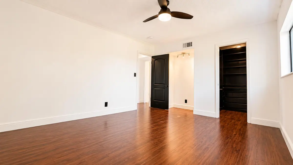 Bright Master Bedroom with Wood Floors at 8801 W Sample Road 4, Coral Springs