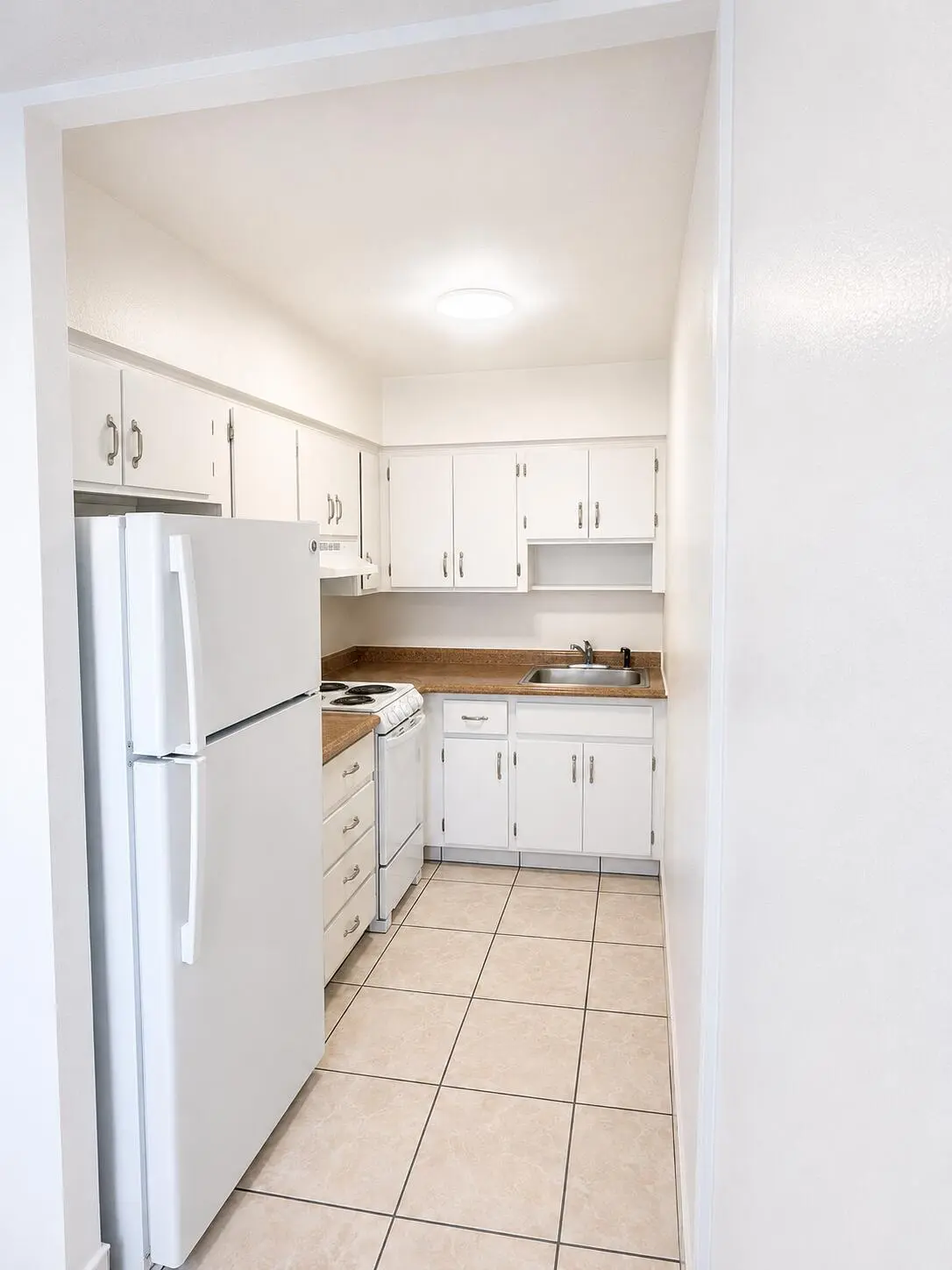 kitchen from dining area at 1814 E Oakland Park 41, Oakland Park