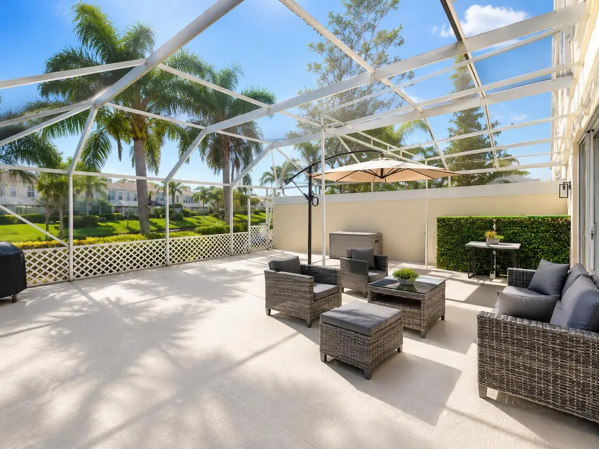 Spacious screened patio at 154 SANTA BARBARA Way, Palm Beach Gardens