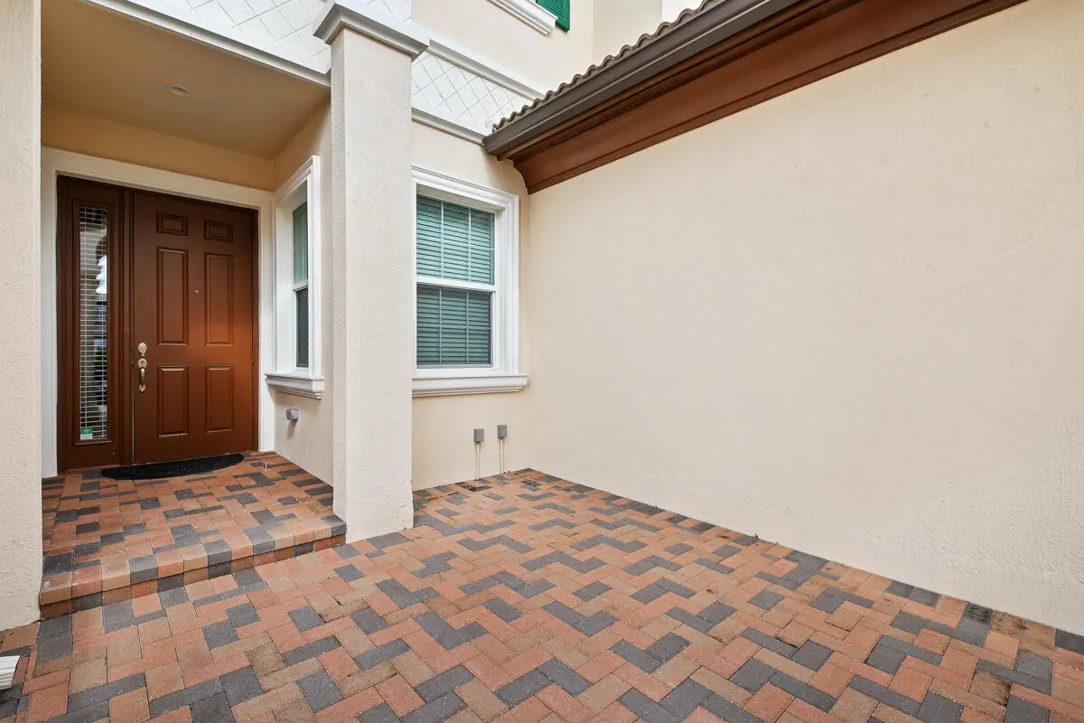 Inviting Courtyard Entry at 159 Tresana Boulevard 113, Jupiter
