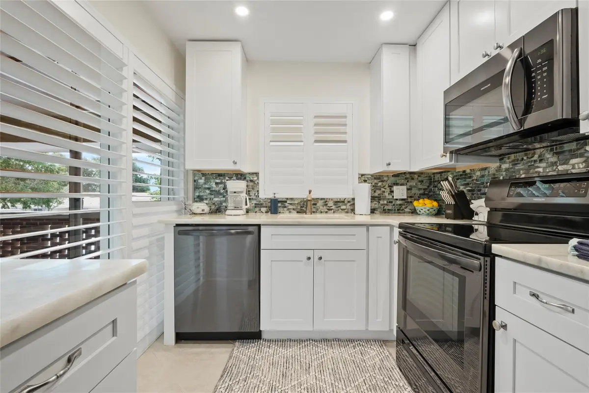 kitchen fully stocked at 1340 NE 28TH Avenue 242, Pompano Beach