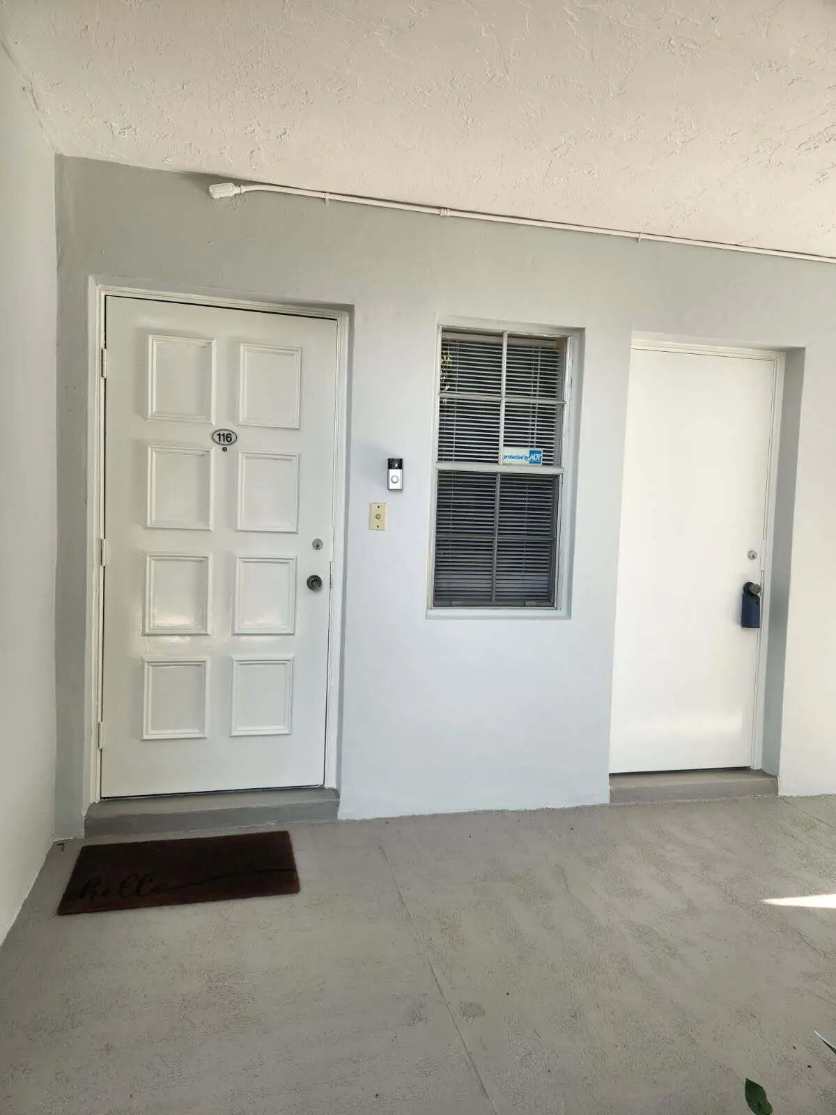 Front door lockbox at 3200 N Course Lane 116, Pompano Beach