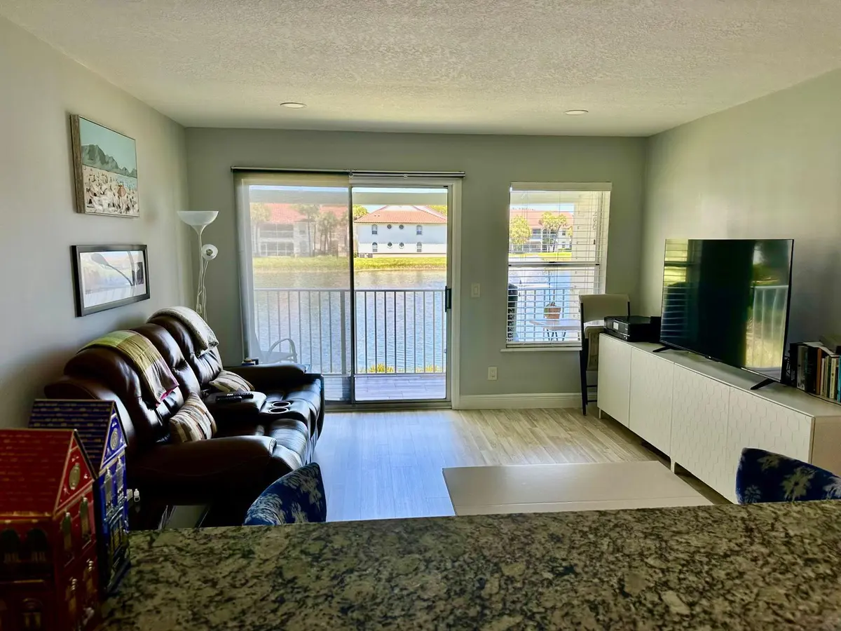 155 cypress living rm from kitchen at 155 CYPRESS POINT Drive, Palm Beach Gardens