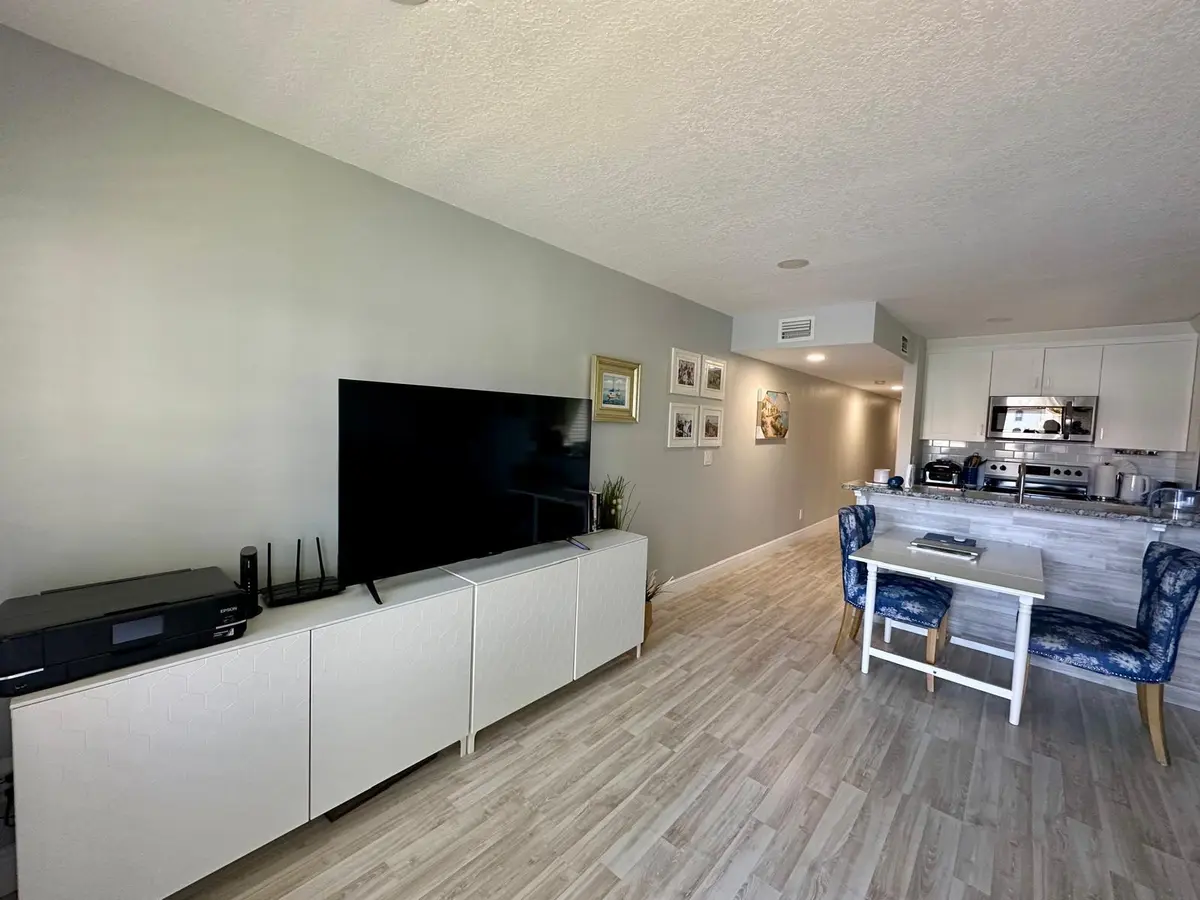 155 cypress living rm litchen, hall view at 155 CYPRESS POINT Drive, Palm Beach Gardens