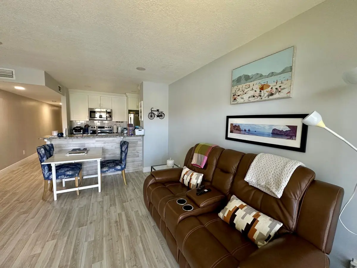 155 cypress living rm kitchen view at 155 CYPRESS POINT Drive, Palm Beach Gardens