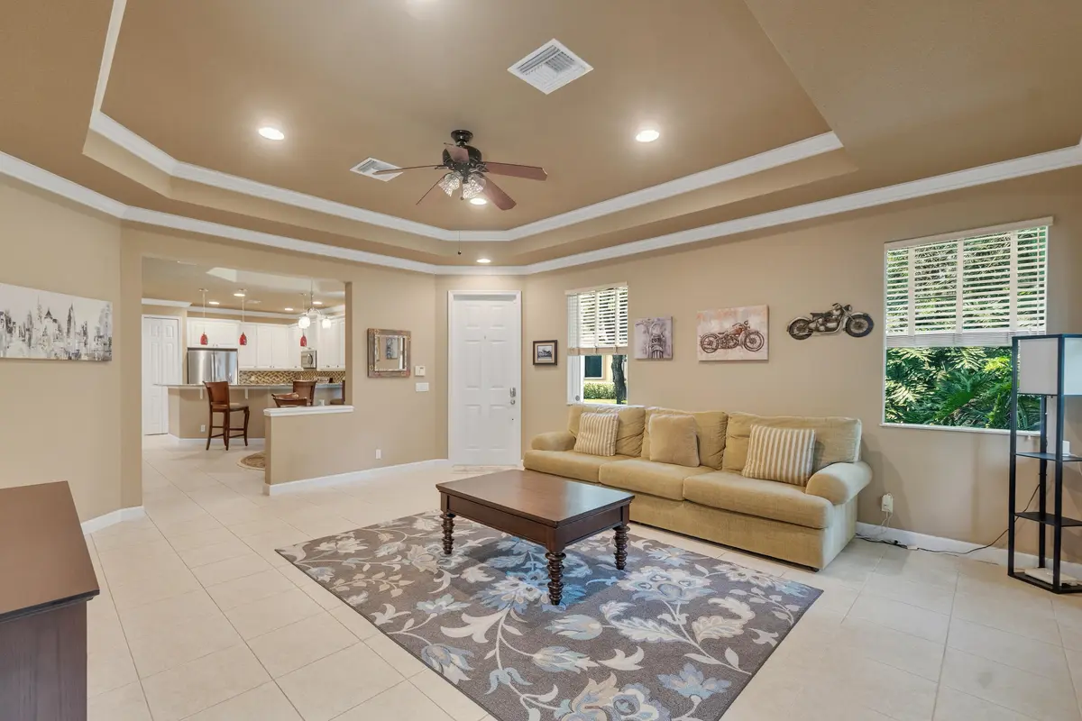 Living Room view into kitchen at 7003 Willow Pine Way, Port St. Lucie