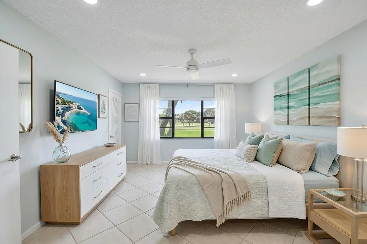 VIRTUAL Primary Bedroom at 7 Southport Lane B, Boynton Beach