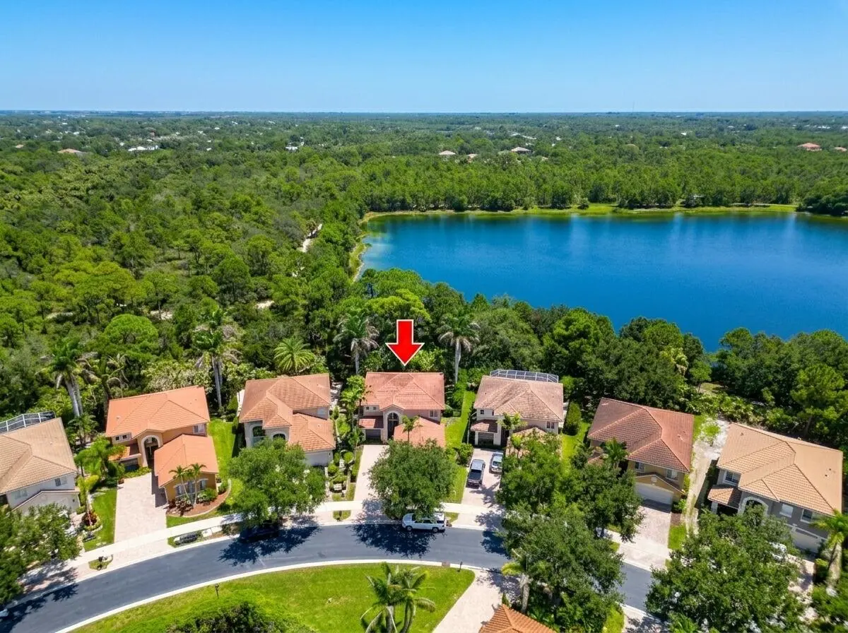Aerial red arrow with lake at 6181 SW Bald Eagle Drive, Palm City