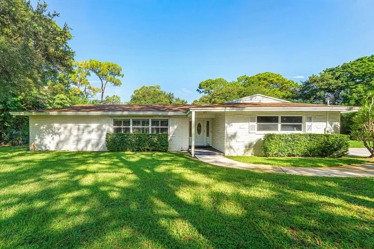 Exterior Front 2 at 8645 Square Lake Drive, Palm Beach Gardens