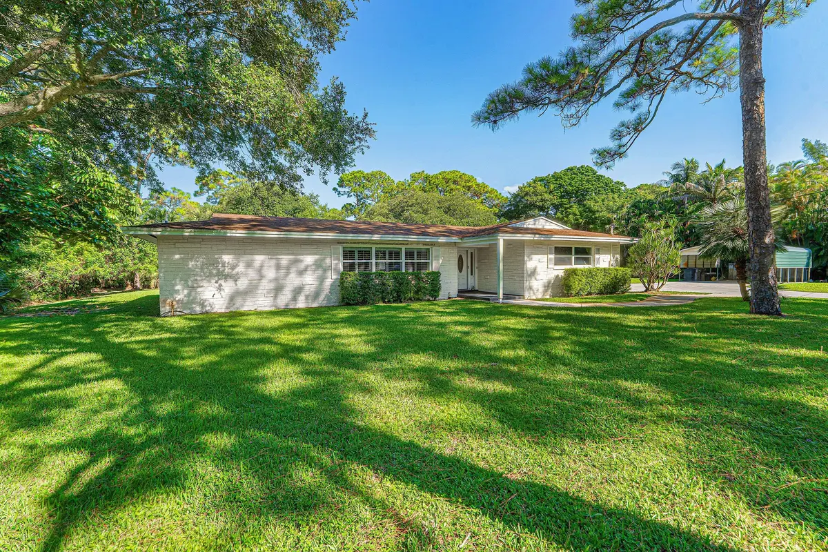 Exterior Front at 8645 Square Lake Drive, Palm Beach Gardens