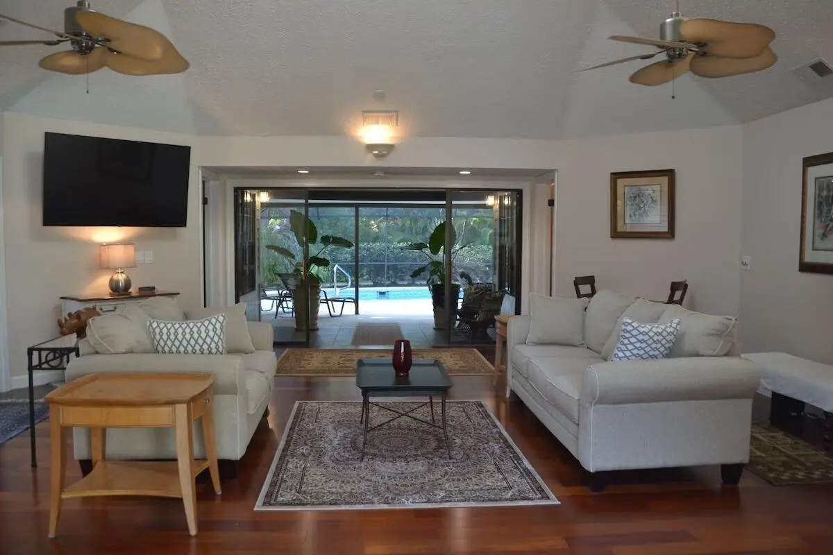 02_Living_Room_Pool_View at 1251 SW CARL METZ Lane, Palm City