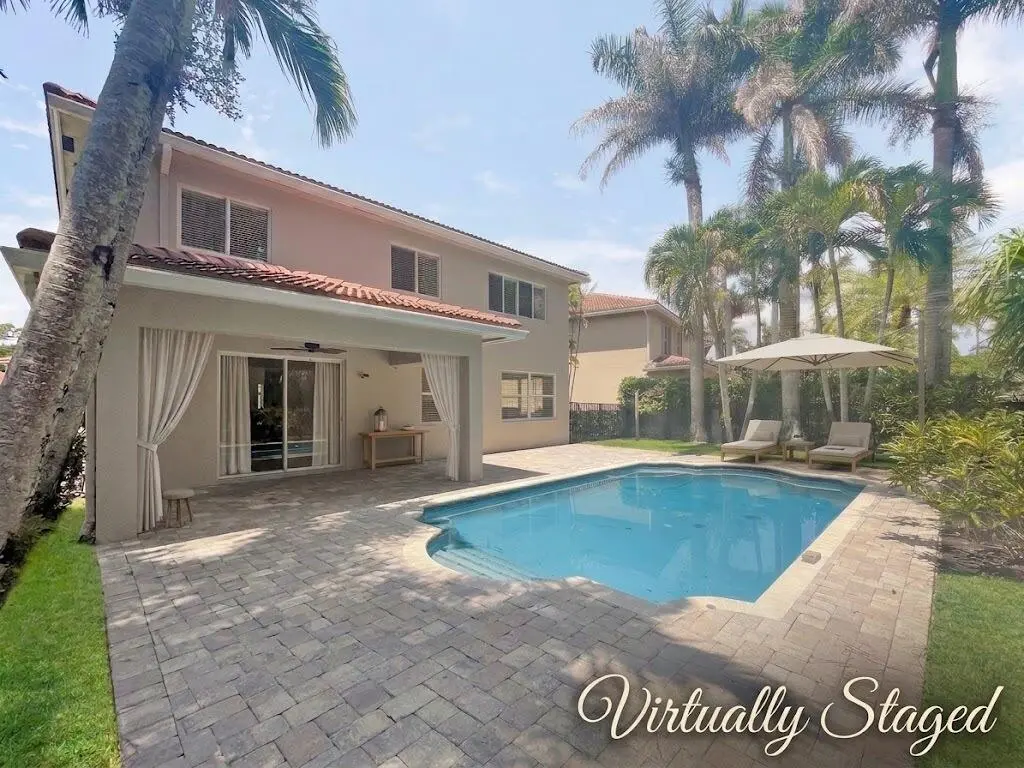 Back of Home Pool Area_AI Staged at 6181 SW Bald Eagle Drive, Palm City