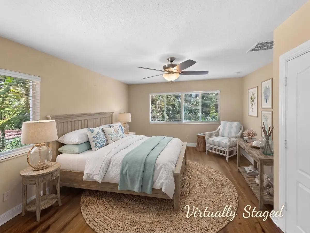 Primary Bedroom_AI Staged at 6181 SW Bald Eagle Drive, Palm City