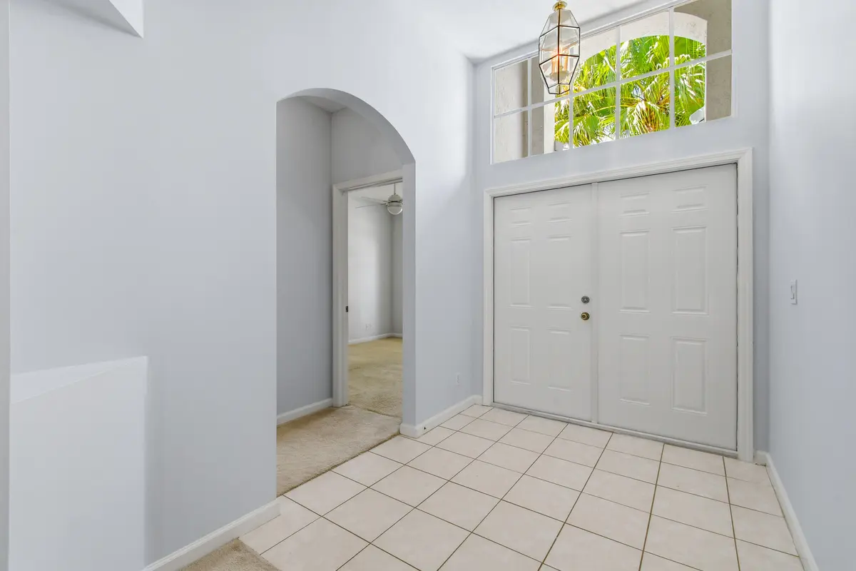 Double Door Entry with Transome Window at 1983 NW Marsh Rabbit Lane, Jensen Beach