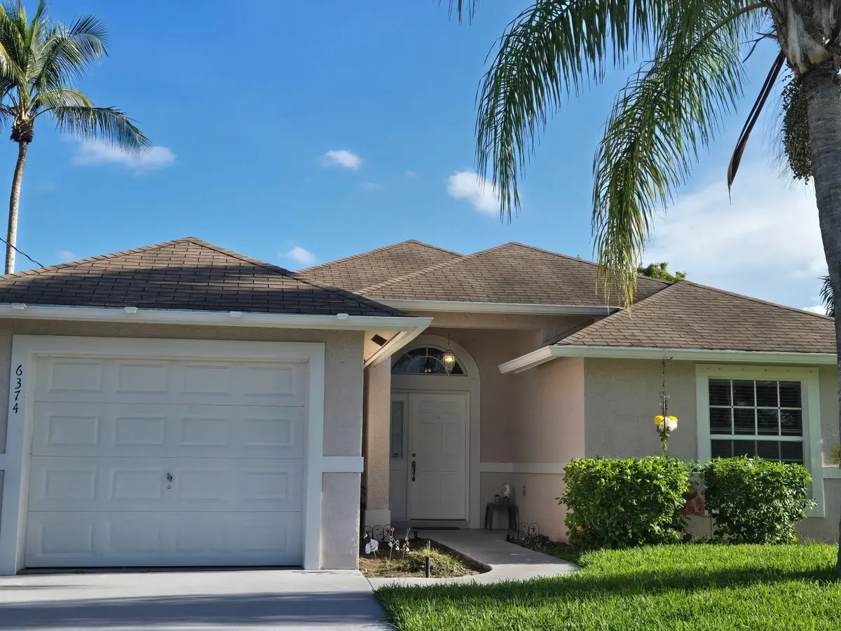 Front west full garage at 6374 Robinson Street, Jupiter