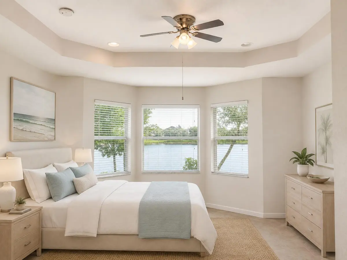 Airy coastal bedroom with bay-window lak at 168 Belle Grove Lane, West Palm Beach