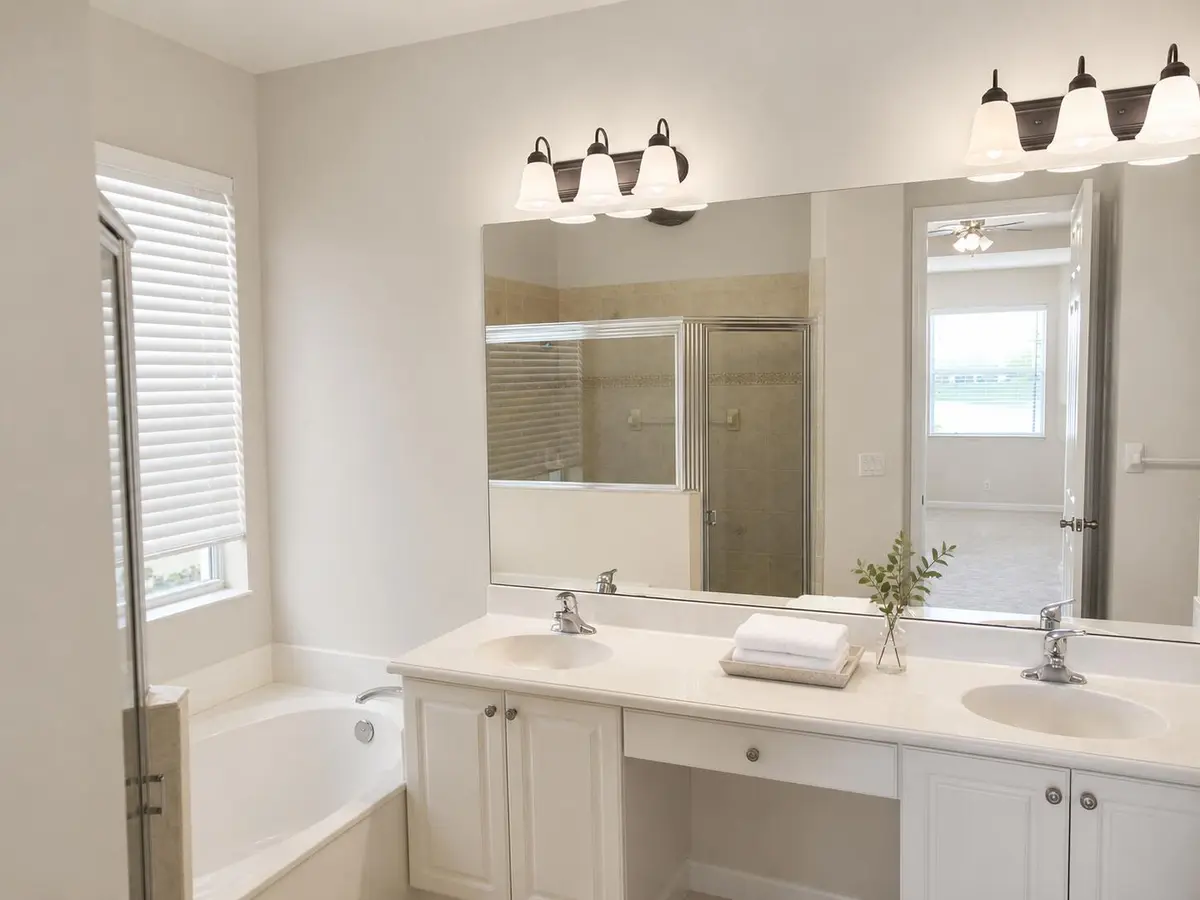 Bright neutral double-vanity bathroom at 168 Belle Grove Lane, West Palm Beach