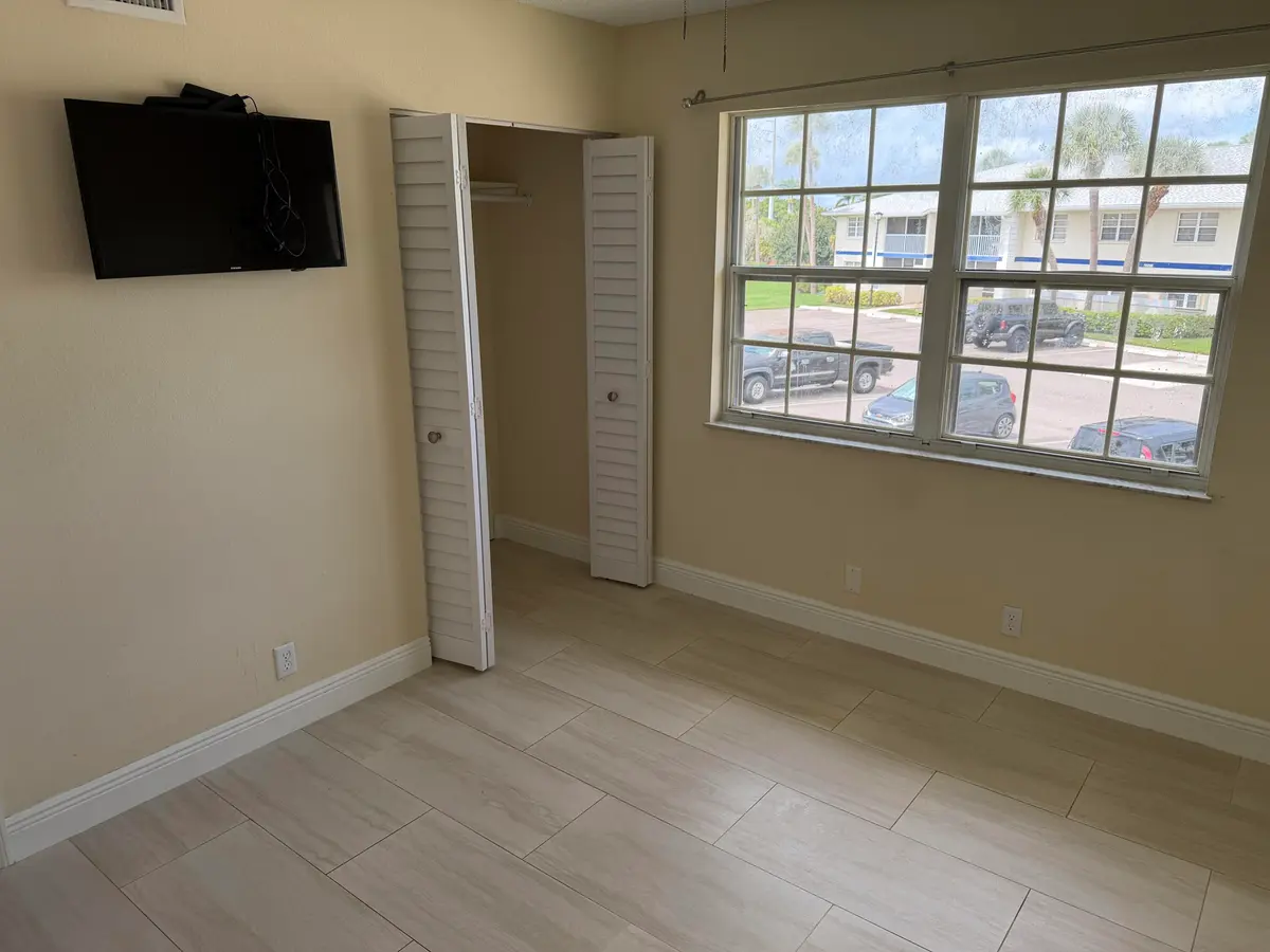 Bedroom 1 at 1512 SE ROYAL GREEN Circle 203, Port St. Lucie