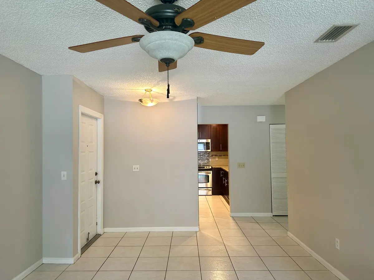 Dining Room across the Kitchen at 9292 Sabal Ridge Circle D, Boca Raton