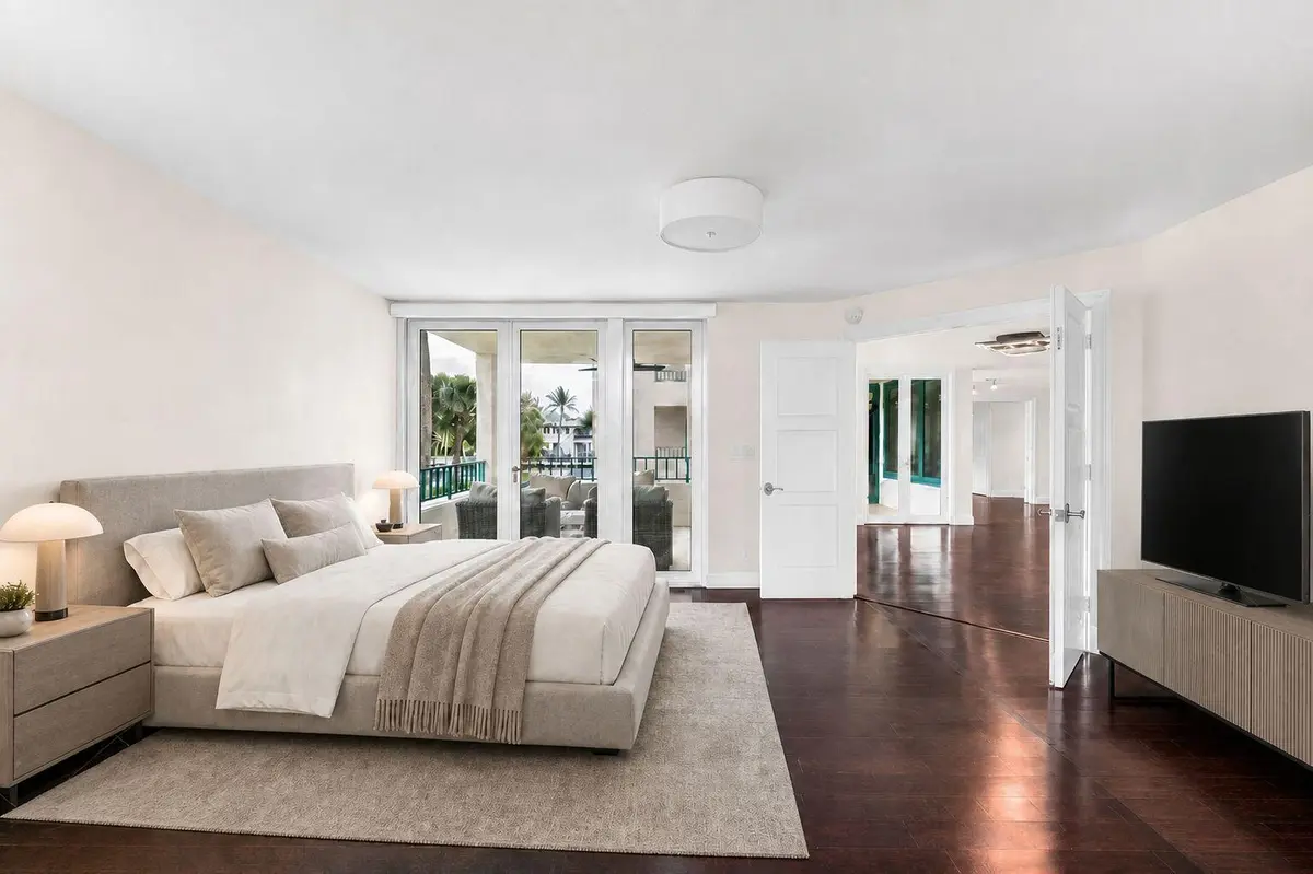 Virtually Staged Primary Bedroom at 100 SE 5TH Avenue 202, Boca Raton