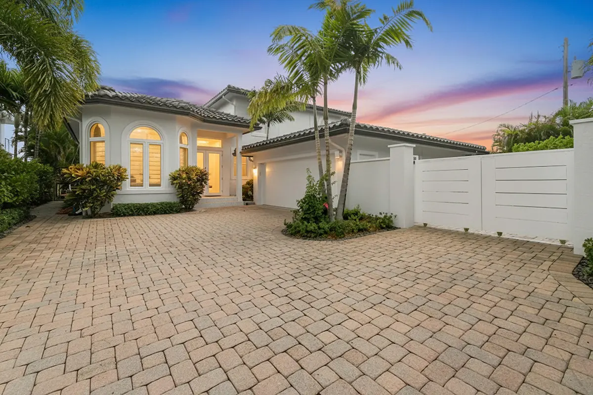 Twilight Front of Home at 3 Lakeside Palms Court, Lake Worth Beach