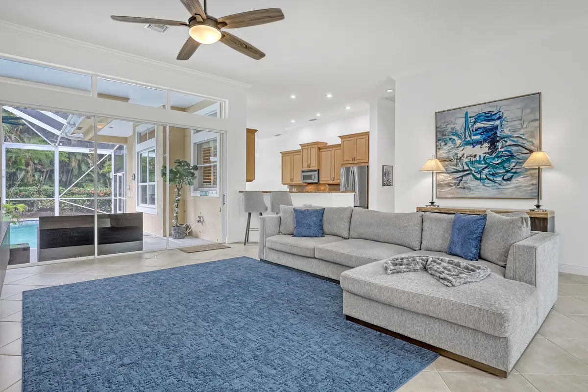 Living Room, Kitchen & Pool Area at 23 Windward Isle, Palm Beach Gardens
