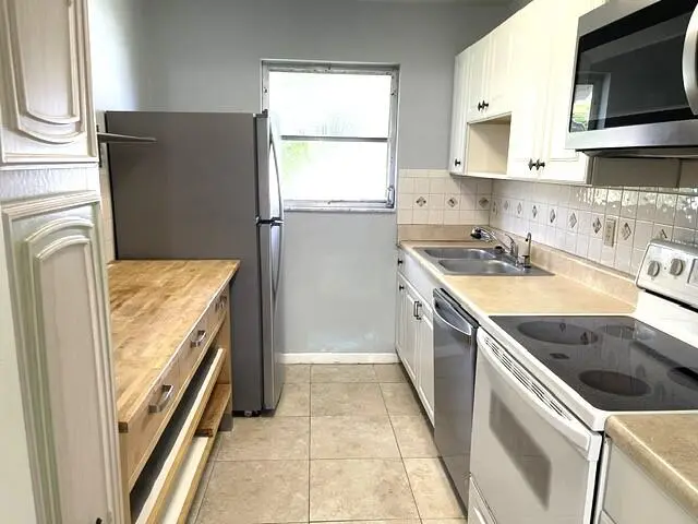 Galley Kitchen with upated appliances at 892 HIGH POINT Boulevard B, Delray Beach