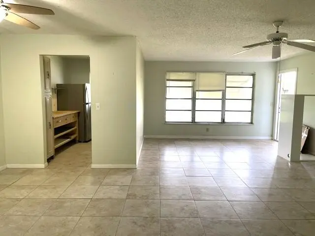 Living room and kitchen view at 892 HIGH POINT Boulevard B, Delray Beach