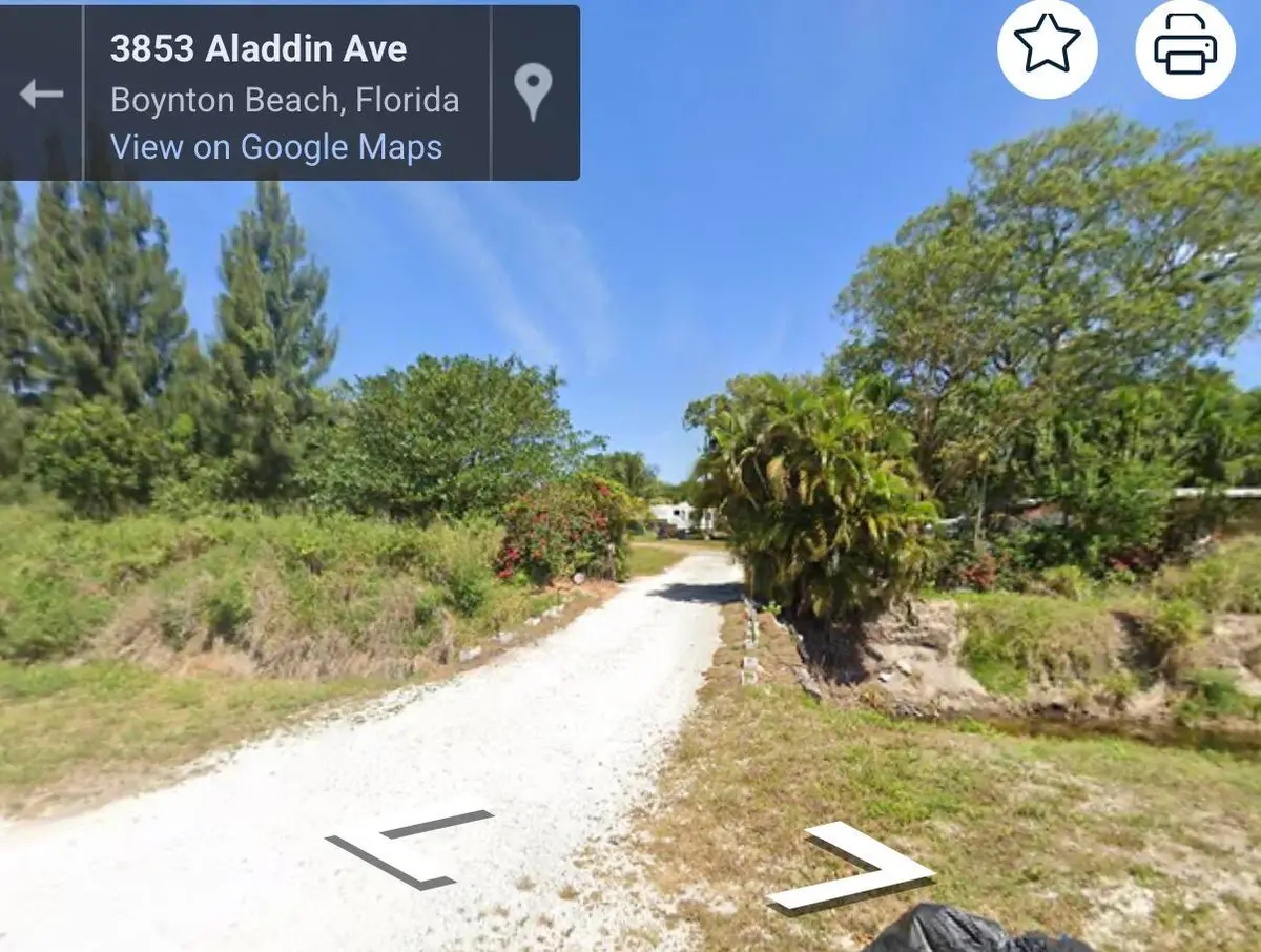 front entrance over canal at 3865 ALADDIN Avenue, Boynton Beach