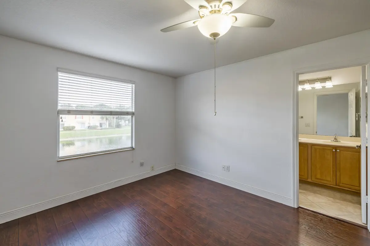 Primary Bedroom Wi. Lake View Into Ensui at 22131 Majestic Woods Way, Boca Raton