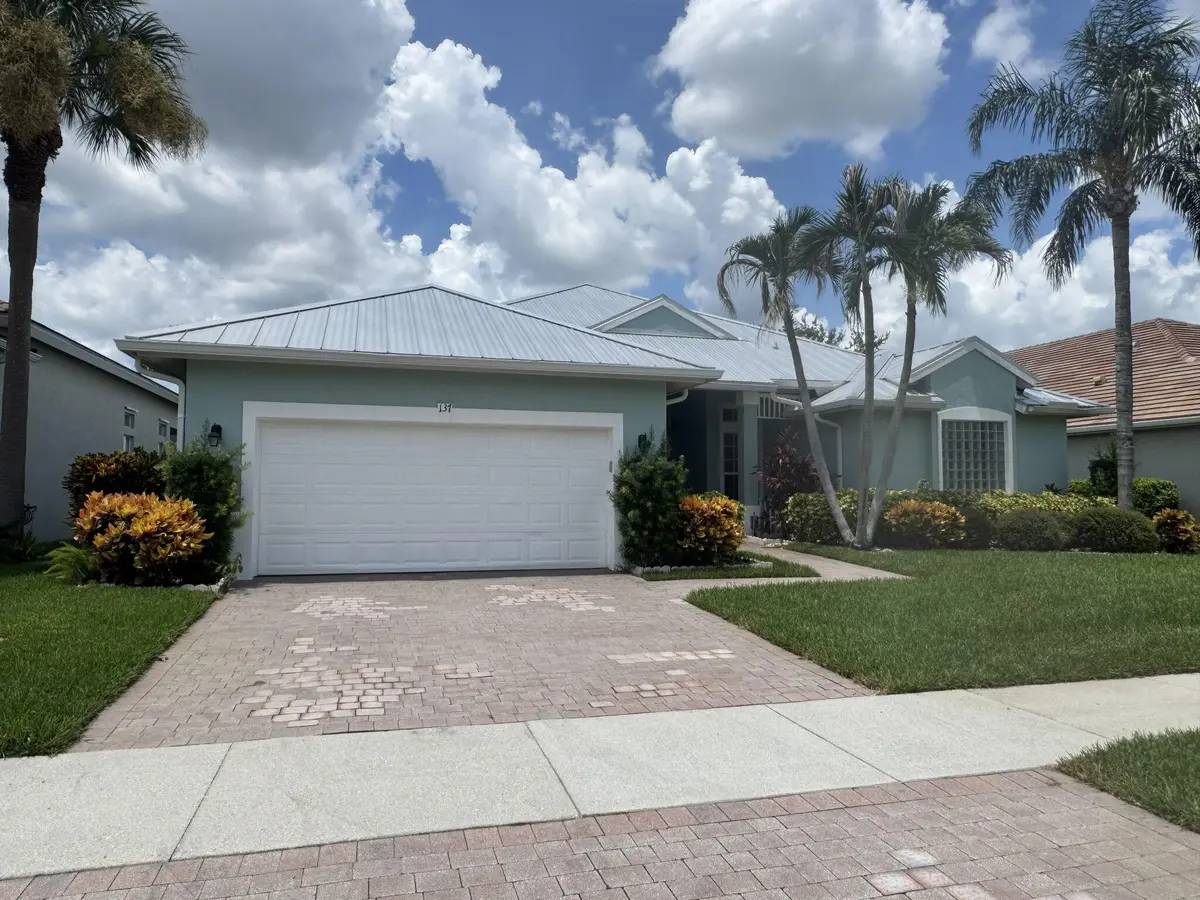 updated magnolia front pics at 137 NW Magnolia Lakes Boulevard, Port St. Lucie