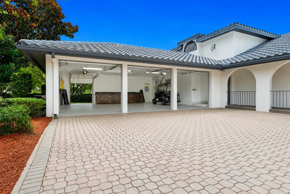 3 car garage plus golf cart garage door at 1157 SW Mirror Lake Cove, Port St. Lucie