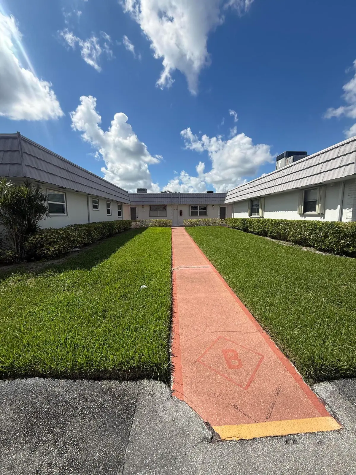 Walkway to villa at 34 Valencia B, Delray Beach