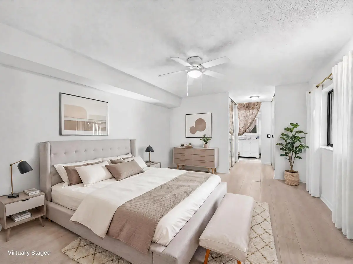 Virtually staged primary bedroom at 1519 15th Terrace, Palm Beach Gardens
