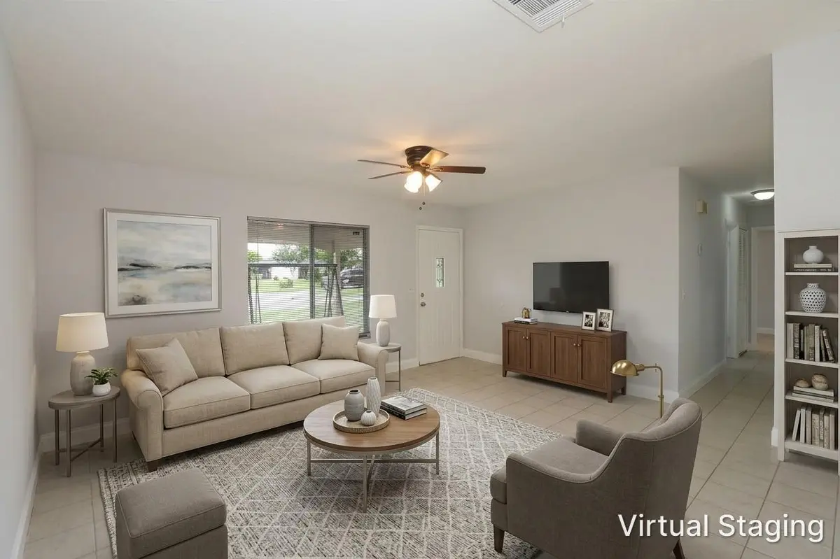Virtual Staged Living Room at 400 SW RUFFNER Court, Port St. Lucie