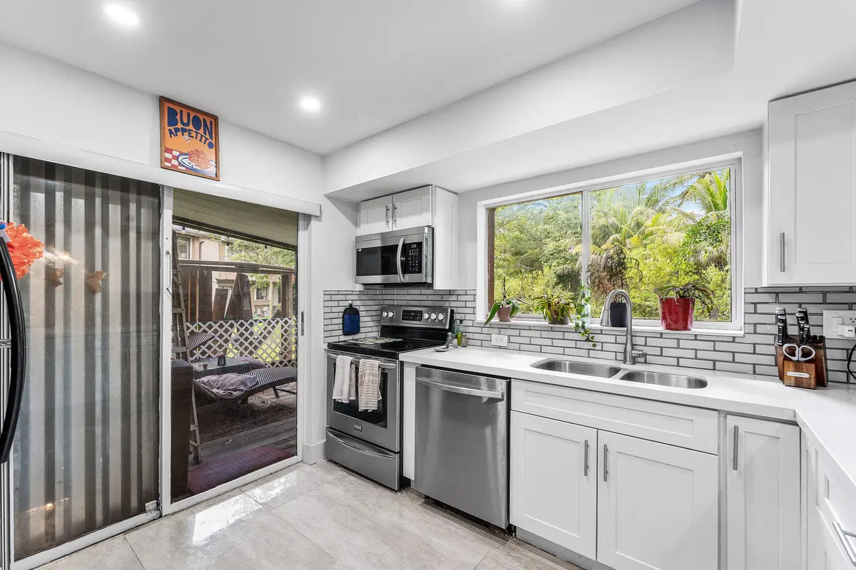 Kitchen with enclosed patio at 209 Wimbledon Lakes Drive, Plantation