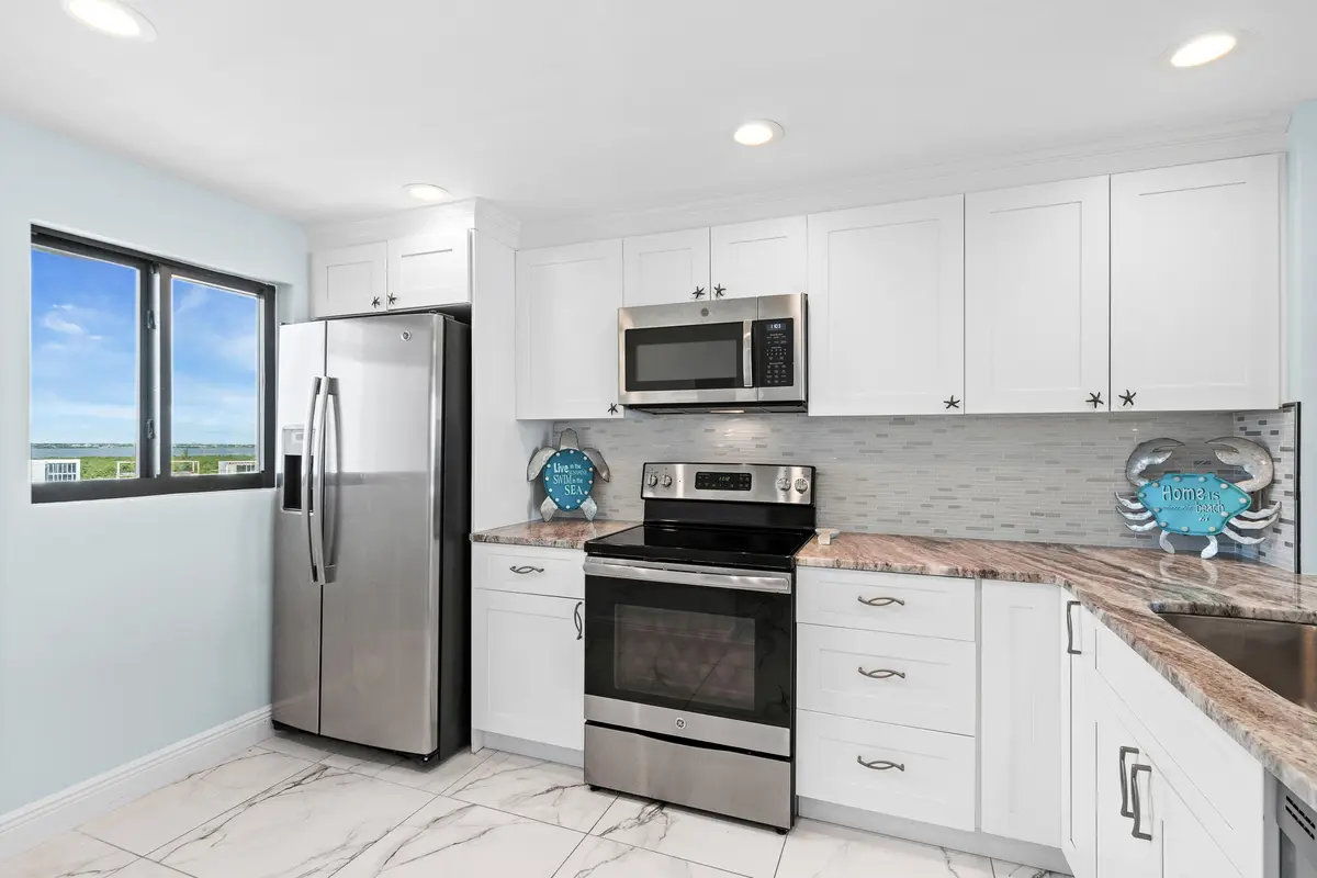 Kitchen and Intracoastal view at 10102 S Ocean Drive 705A, Jensen Beach