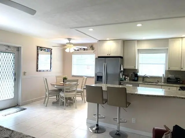 Dining and open concept kitchen at 184 Tuscany C, Delray Beach