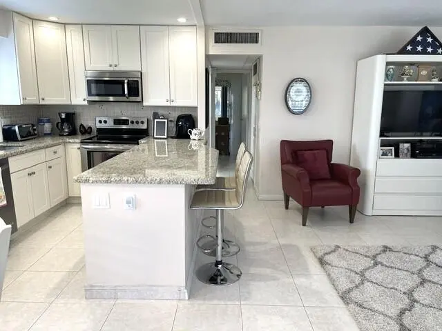 Open concept kitchen and living area vie at 184 Tuscany C, Delray Beach
